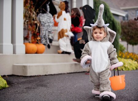Child in Halloween costume trick or treating
